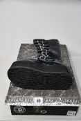 A pair of women's as new Demonia Damned 318 platform boots (UK 7 - RRP £150).