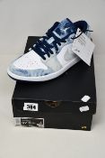 A pair of as new Nike Air Jordan 1 Low SE trainers (UK 9.5).