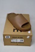 A pair of as new Adidas Yeezy Slide (UK 9).
