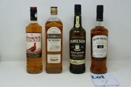 Five bottles of miscellaneous whiskeys to include The Famous Grouse, Bushmills The Original and