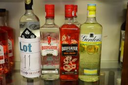 Five bottles of miscellaneous gins to include Beefeater London, Gordans and Brecon Botanicals (