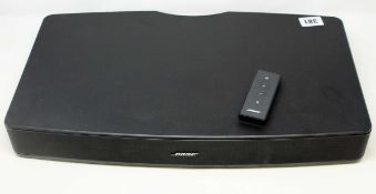 A pre-owned Bose Solo Television Sound System with remote and power cable (Powered on but not tested