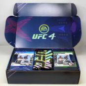A boxed as new EA Sports UFC 4 Bundle including: an EA Sports UFC 4 game disk for Sony PS4, an EA