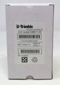 A boxed as new Trimble Rechargeable Li-Ion Battery For Robotic Total Stations (P/N: 99511-30).