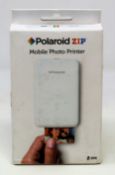 A boxed as new Polaroid ZIP Mobile Printer in White (Box sealed).