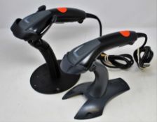 Three pre-owned Honeywell 1400g USB Barcode Scanners with stands.