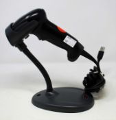 Three pre-owned Honeywell Voyager 1250g USB Barcode Scanners (P/N: 1250g-2) with stands.