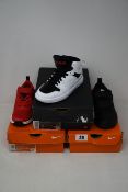 Three pairs of junior as new Nike trainers; Jordan Access (UK 11.5), Downshifter 10 (UK 10) and Pico
