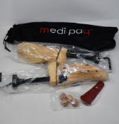 Fifteen pairs of as new Medipaq wooden shoe stretchers.