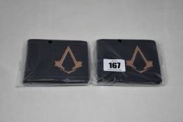 Twenty as new Assassin's Creed Syndicate Bronze Brotherhood Crest bi-fold wallets.