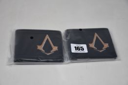 Twenty as new Assassin's Creed Syndicate Bronze Brotherhood Crest bi-fold wallets.