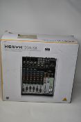 A boxed Behringer XENYX 1204USB Mixer.
