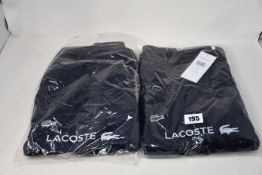 Two pairs of as new Lacoste Sport logo joggers (Fr 6,7).