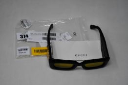 A pair of lady's as new Gucci GG0816S 001 Sunglasses in black leather (No case).