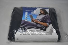 Eight Travelrest Ultrasoft travel blankets in grey.