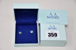 A pair of ladies boxed as new Miore 9kt yellow gold earrings (Swarovski elements and emerald).