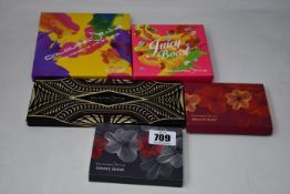 A collection of five Coloured-Raine eye shadow sets to include: one Juicy Boost 18 colour set, one