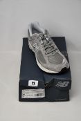 A pair of as new New Balance 2002R marblehead light aluminium (UK 11.5).