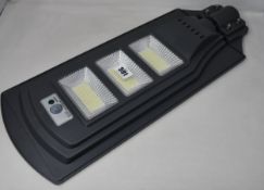 Three Solar powered LED Street Lamps with remote control and motion sensor.