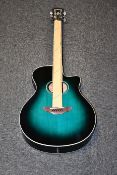 A boxed as new Yamaha APX600 electro acoustic guitar in oriental blue.