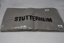 An as new Stutterheim Stockholm Potato unisex raincoat (L - RRP £130).
