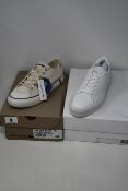 A pair of as new Calvin Klein Janika trainers (EU 37) and a pair of Lacoste Gripshot trainers (UK