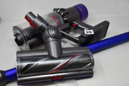 A pre-owned Dyson V11 Absolute (Nickel/Blue) vacuum cleaner (Requires UK adapter).