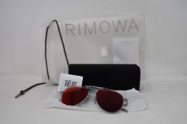 A pair of as new Rimowa sunglasses.