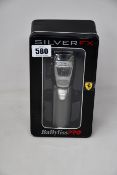 An as new BaByliss Pro Silver FX870S metal cordless clipper.