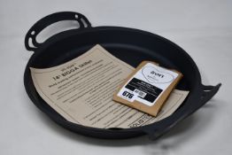 A SolidTeknics US-ION 14inch Bigga Skillet with Iron Love seasoning conditioner.