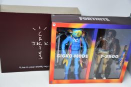 A boxed as new Cactus Jack x Fortnite - Travis Scott duo action figure set.