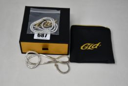 Two GLD round cut tennis necklaces white gold plated with pouch and boxed.