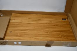 A boxed Every Day Goal Electronic Calendar designed by Simone Giertz.