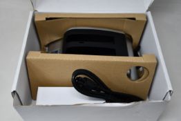 A boxed as new RRC 2-bay battery charger (PN: PMC02A) (Requires UK adapter).