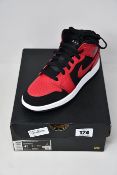 A pair of as new Nike Air Jordan 1 Mid (UK 4).