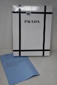 An as new wrapped/bound Prada FW20 Collection auction catalogue (The advertising campaign for the
