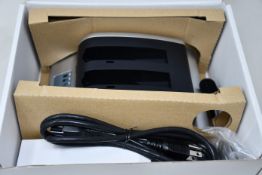 A boxed as new RRC 2-bay battery charger (PN: PMC02A) (Requires UK adapter).