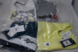 Seven items of assorted as new Reebok sportswear; women's Essential running tights (XL) with