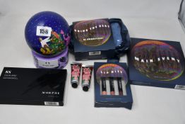 A collection of cosmetic items to include: 12x Body Shop festive berry hand cream tubes (30ml), 1x