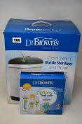 A collection of boxed Dr Brown's Baby Feeding items to include: 1 x Clean Steam Bottle Sterilizer