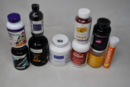 A quantity of assorted health supplements + vitamins and related items.