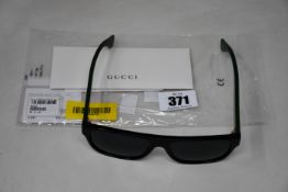 A pair of men's as new Gucci GG0341S 001 Sunglasses (56-17-150, no case).