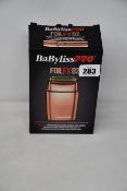 A boxed Babyliss PRO FoilFX02 double foil shaver (May require UK adaptor, some attachments may be