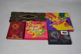 A collection of five Coloured-Raine eye shadow sets to include: one Juicy Boost 18 colour set, one