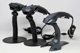 Three pre-owned Honeywell 1400g USB Barcode Scanners with stands.