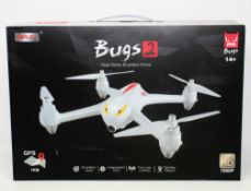 A boxed as new MJX Bugs 2 Brushless Quadcopter Drone (UK plug adapter required) (Box sealed).