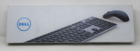 A boxed as new Dell KM717 Premier Keyboard And Mouse Set (VPN: KM717-GY-UK) (Box sealed, some damage