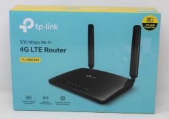 A boxed as new TP-Link TL-MR6400(EU) 300Mbps Wi-Fi 4G LTE Router (Box opened).