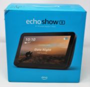 A boxed as new Amazon Echo Show 8 Smart Speaker with Alexa (Box opened, some damage to box).