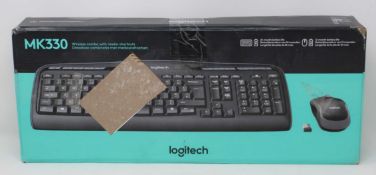 A boxed as new Logitech Wireless Combo MK330 Keyboard & Mouse Set in Black (Box sealed. damaged